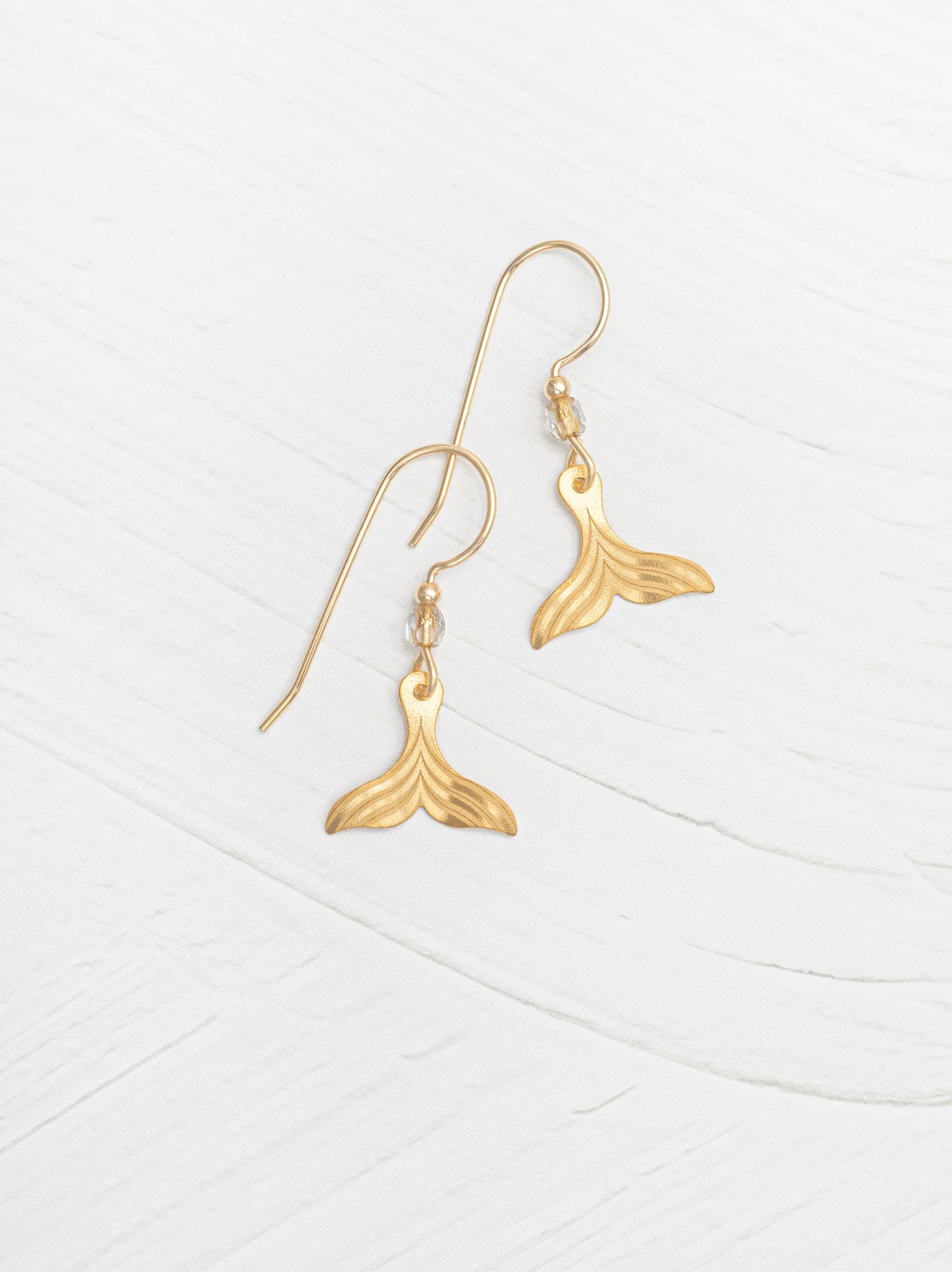 whale tail earrings by Holly Yashi