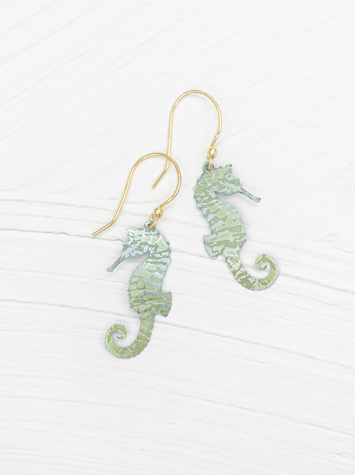 light green seahorse earrings by Holly Yashi