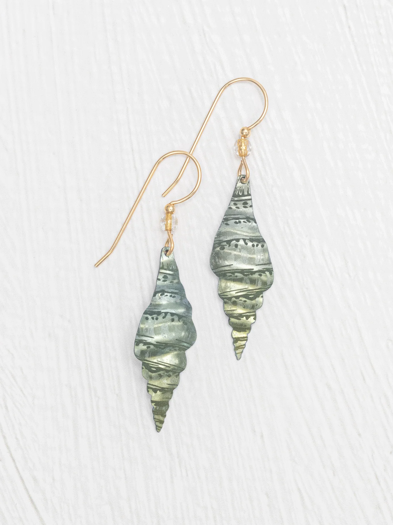 light green triton sea shell earrings by jewelry designer Holly Yashi
