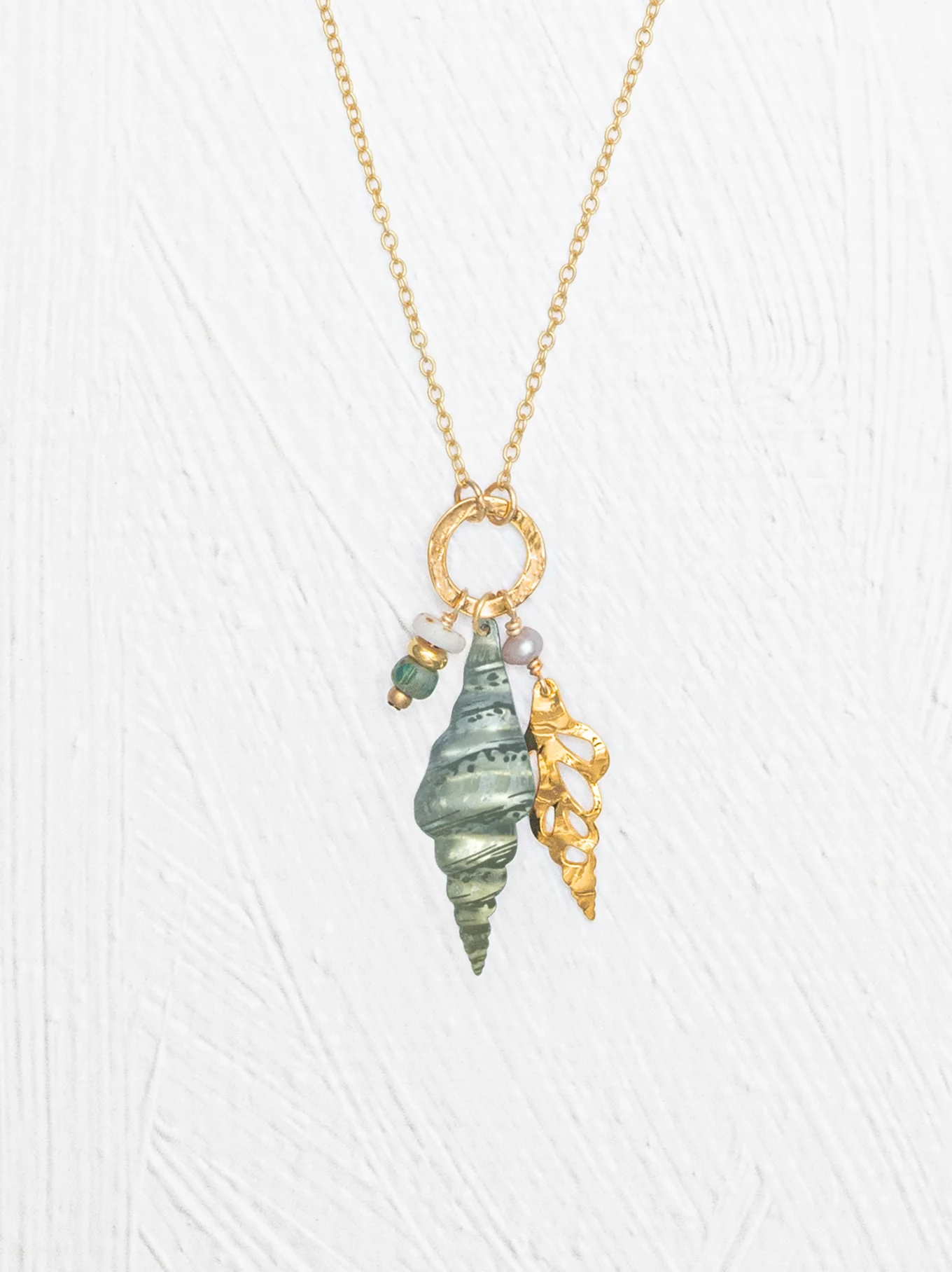 long triton shell necklace close-up