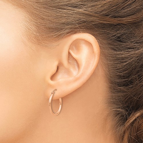 10K rose gold hoop earrings on model