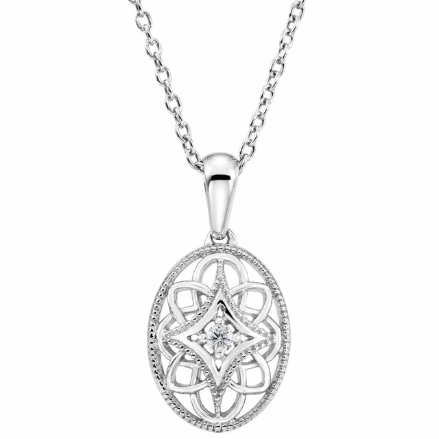 oval filigree pendant with diamond center