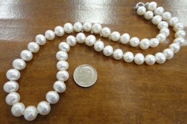 pearl necklace with dime for scale