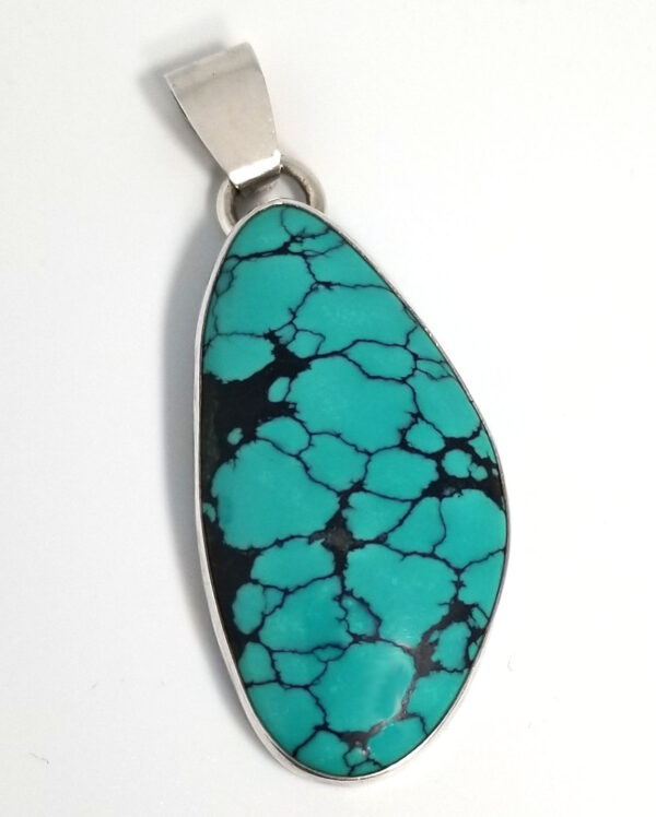 Large turquoise and sterling silver pendant by Dale Repp