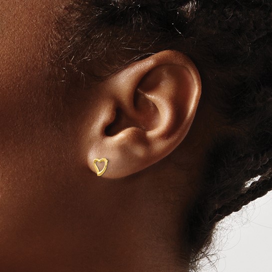 heart stud earrings on woman