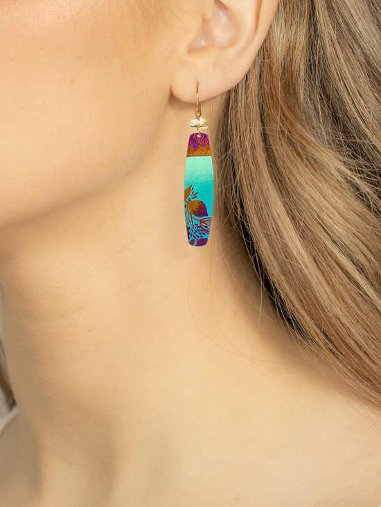 teal koa earrings by jewelry designer Holly Yashi on model