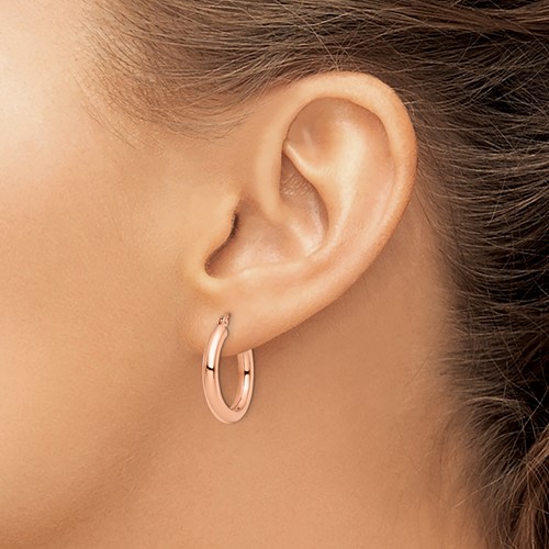 14k rose gold hoop earrings on model