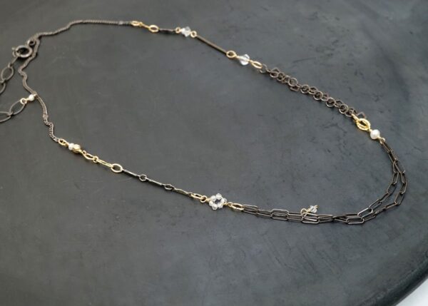 dainty mixed metal necklace with pearl and quartz accents