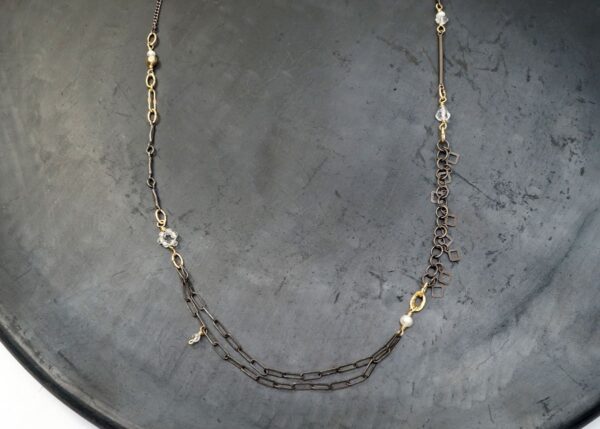 dainty mixed metal necklace with pearl and quartz accents