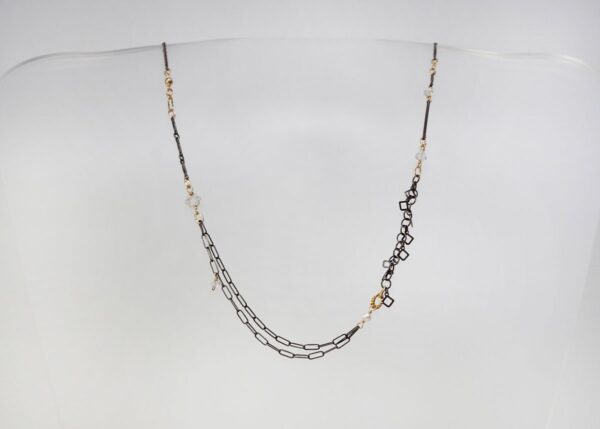dainty mixed metal necklace with pearl and quartz accents