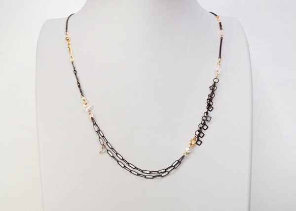 dainty mixed metal necklace with pearl and quartz accents
