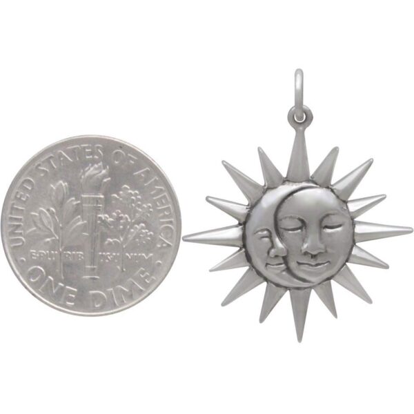 sun and moon charm with dime to help gauge scale