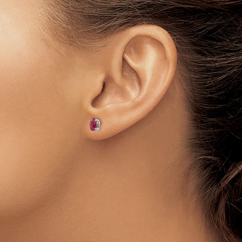 ruby and 14K white gold stud earring on ear