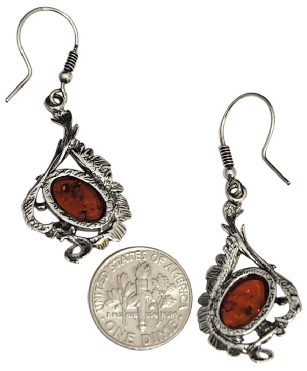 backside of amber drop earrings with dime for size comparison
