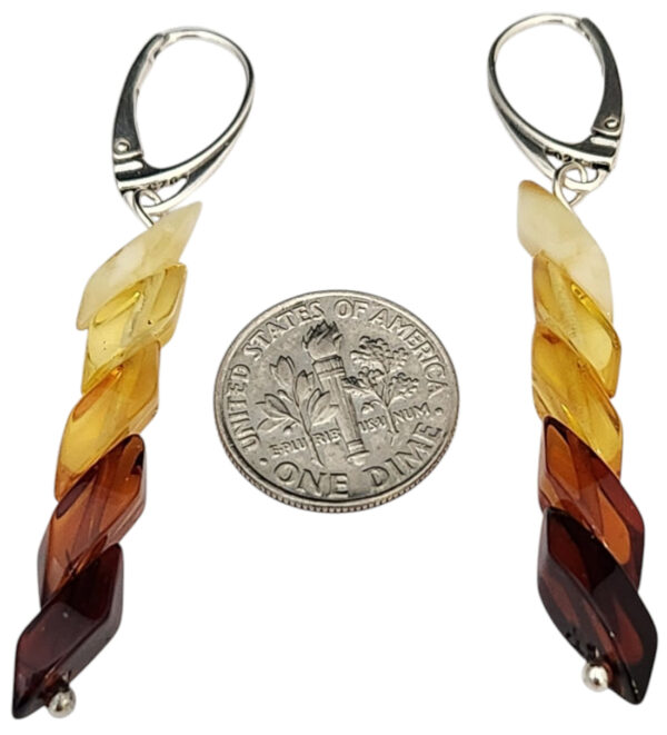 light to dark amber earrings with dime for size comparison