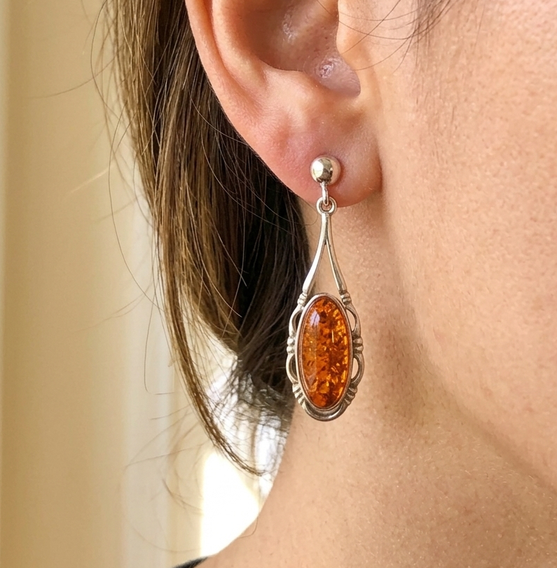 amber earrings on woman