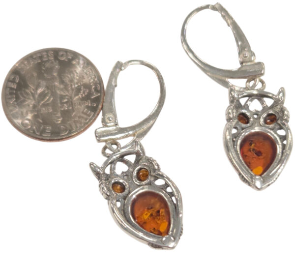 backside of amber owl earrings with dime for size comparison