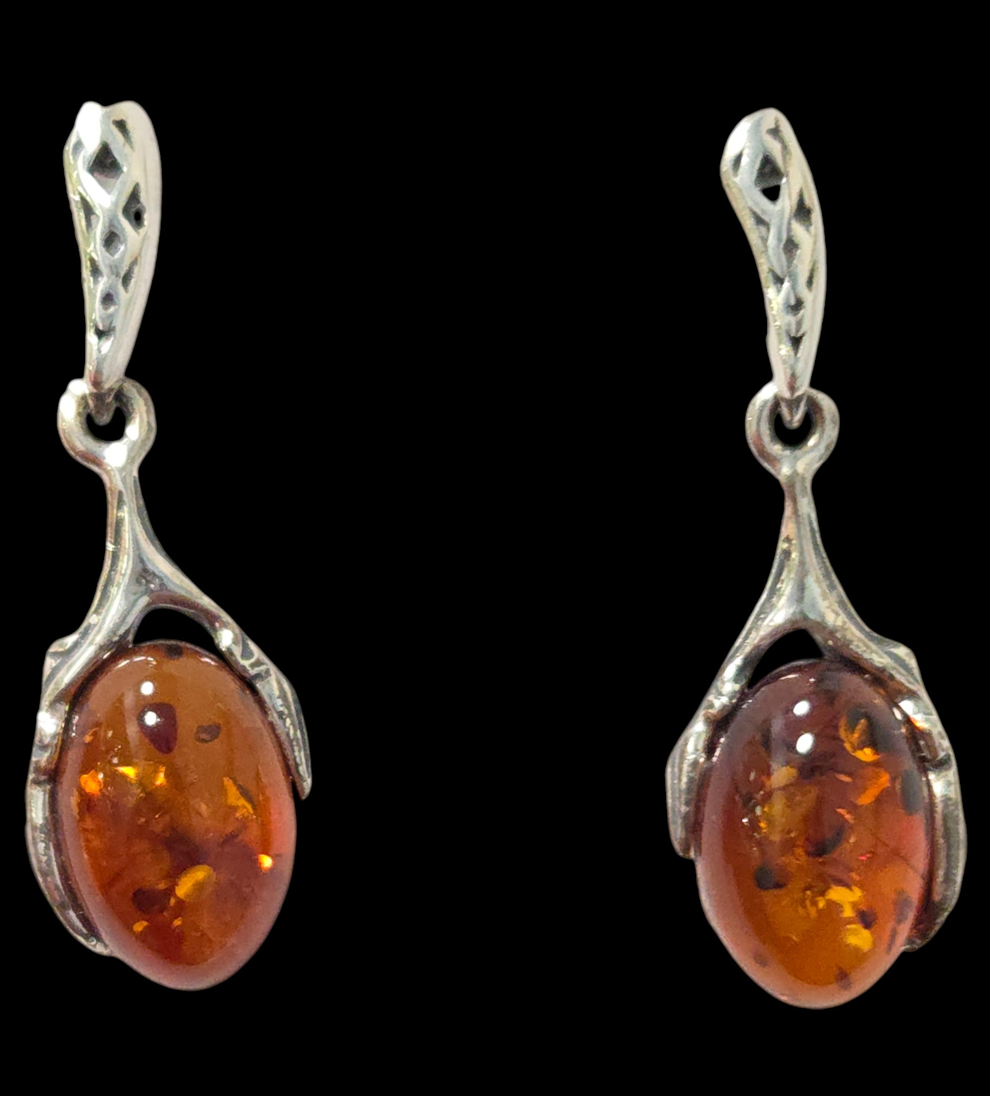 amber earrings with black background