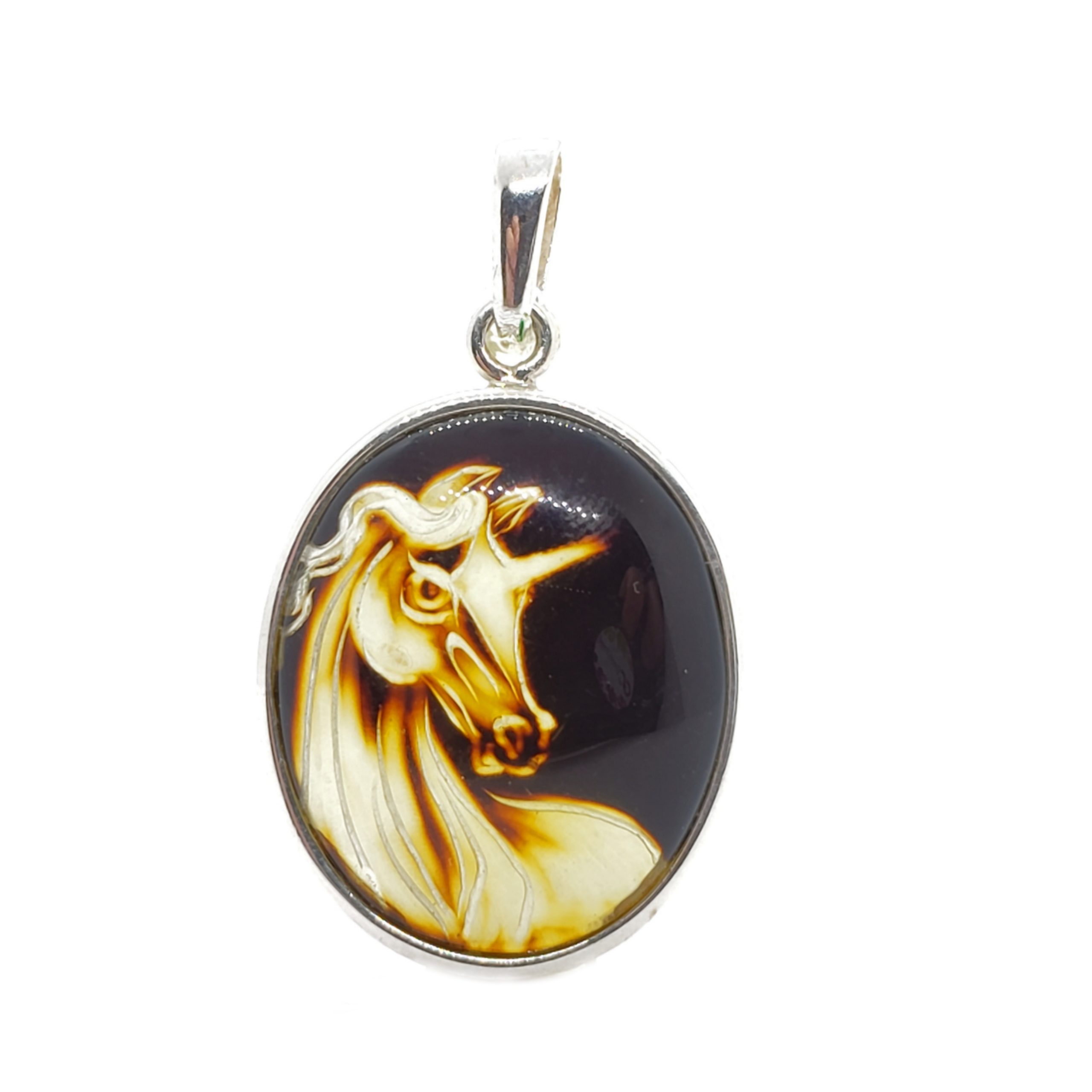 carved amber unicorn and sterling silver oval pendant