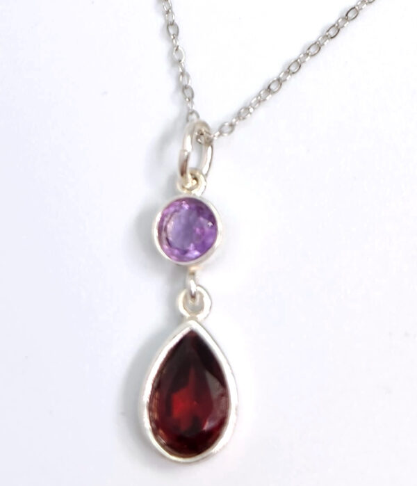 Purple amethyst and red garnet gemstone pendant on 18 inch sterling silver chain