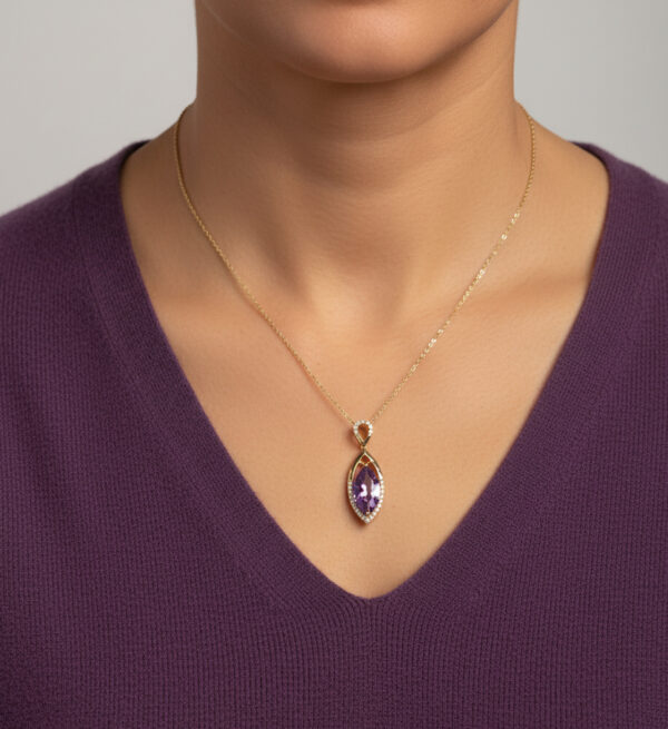 gold, amethyst, and diamond necklace on model