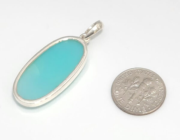 aqua chalcedony pendant backside with dime for size comparison