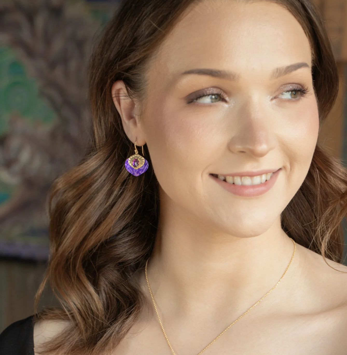 purple pointed drop earrings by Holly Yashi on model