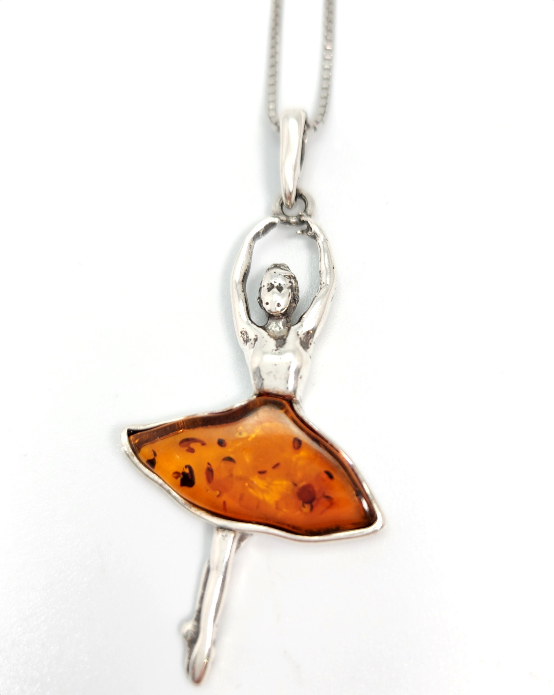 Ballerina necklace made from sterling silver and Baltic amber