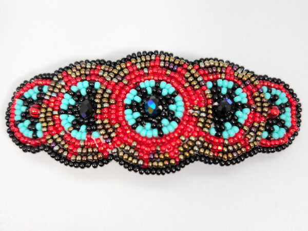 beaded barrette in red, light blue, black and bronze color