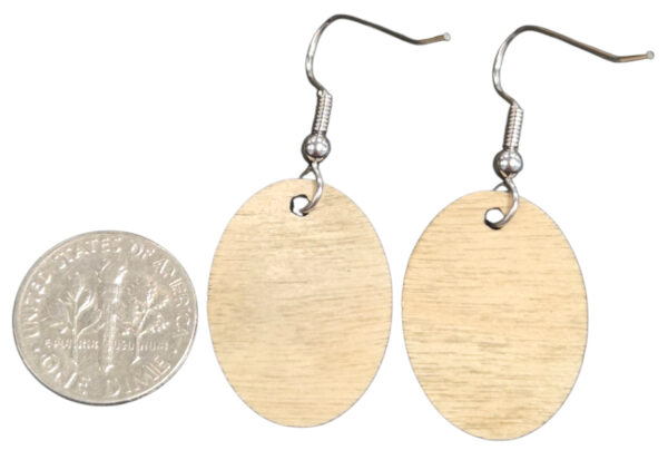 backside of wooden earrings with dime for size comparison