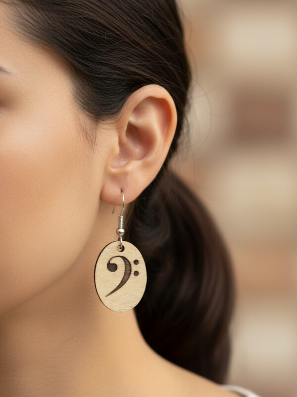 wooden bass clef earrings on model