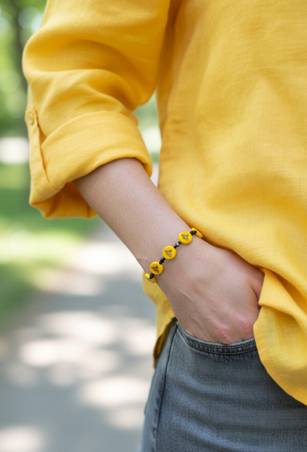 handmade dainty bee bracelet on model