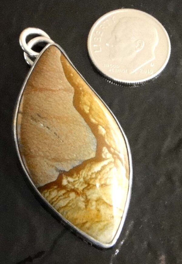 Biggs Canyon jasper and sterling silver pendant by Dale Repp with dime for size
