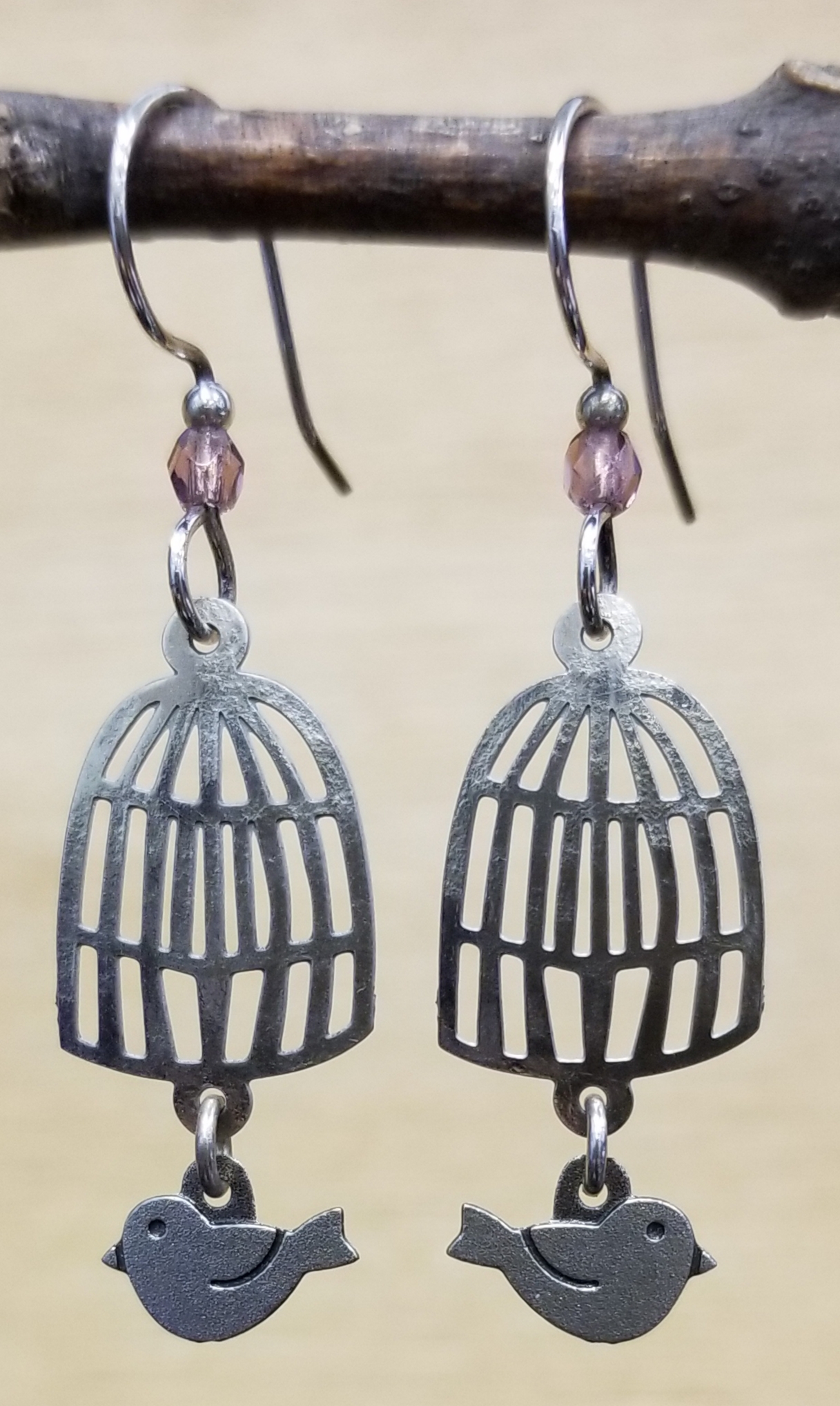 Bird and birdcage earrings with violet bead