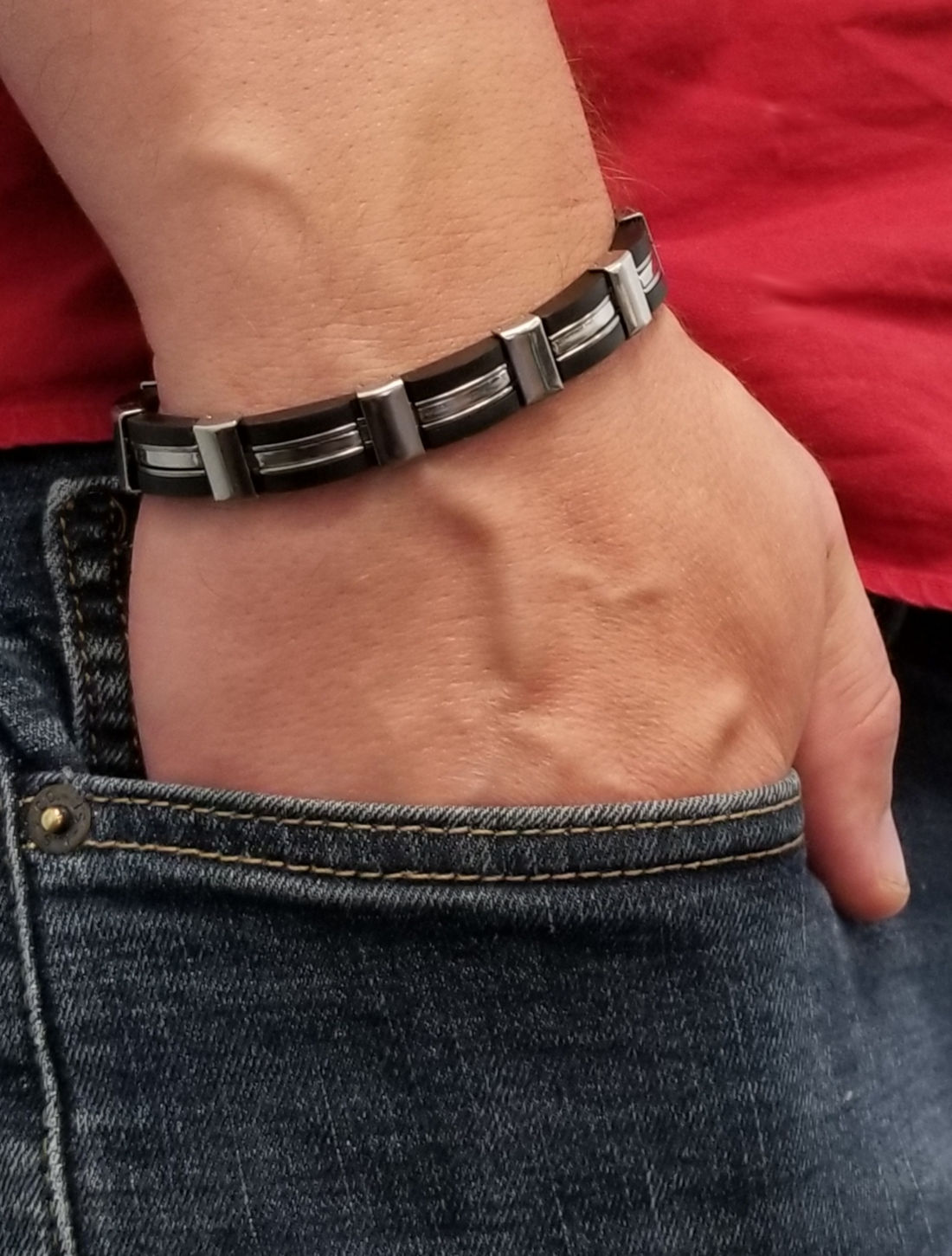 black and stainless steel bracelet on model