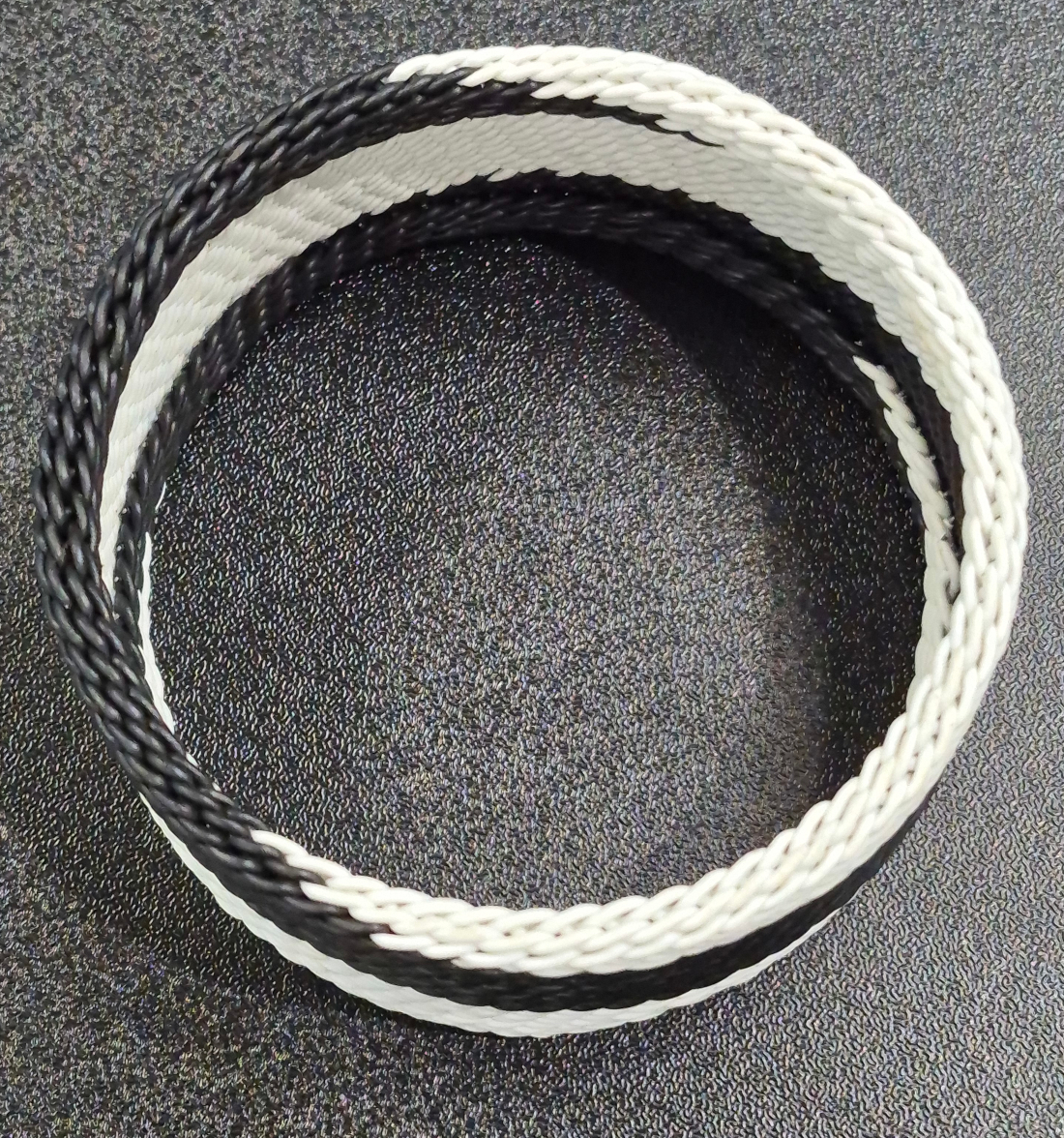 top view of black and white telephone wire bangle bracelet