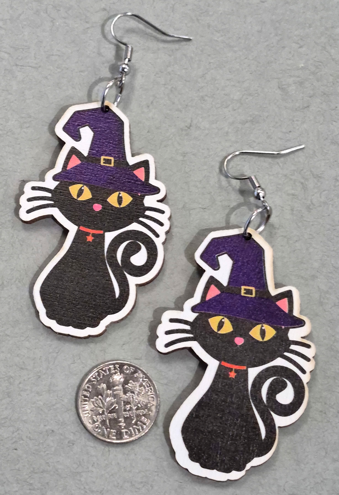 Halloween Cat earrings with dime for size comparison
