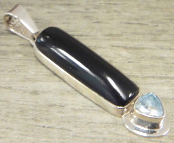 handmade black onyx, blue topaz, and sterling silver pendant