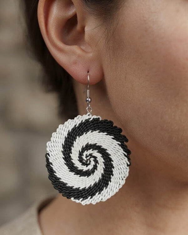 black and white repurposed telephone wire earrings on model