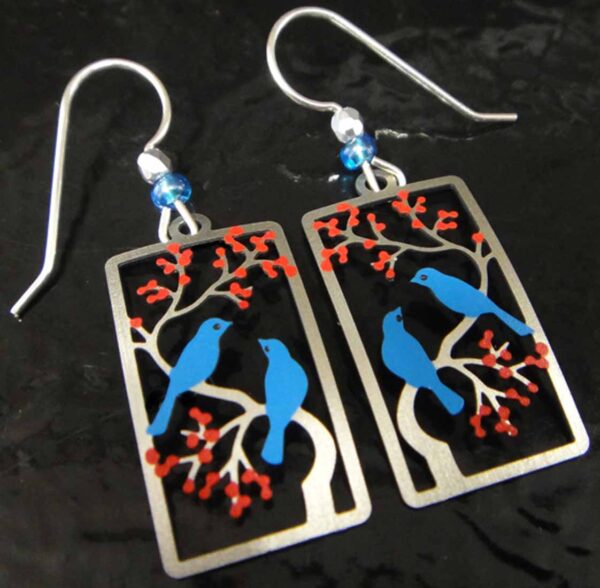 blue bird on cherry tree earrings by Sienna Sky on black background