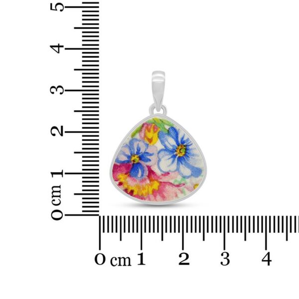 pink and blue flower pendant with ruler