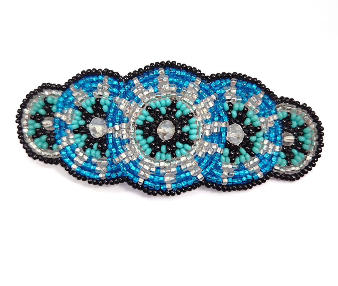 beaded hair barrette in bright blue, light blue, silvetone, and black glass beads