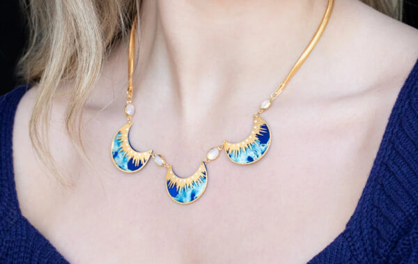 blue moon necklace on woman