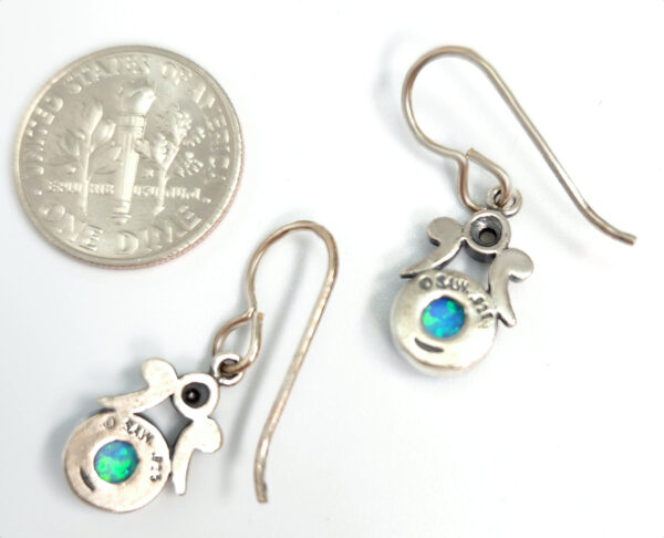 Backside of created blue opal earrings with dime for size comparison