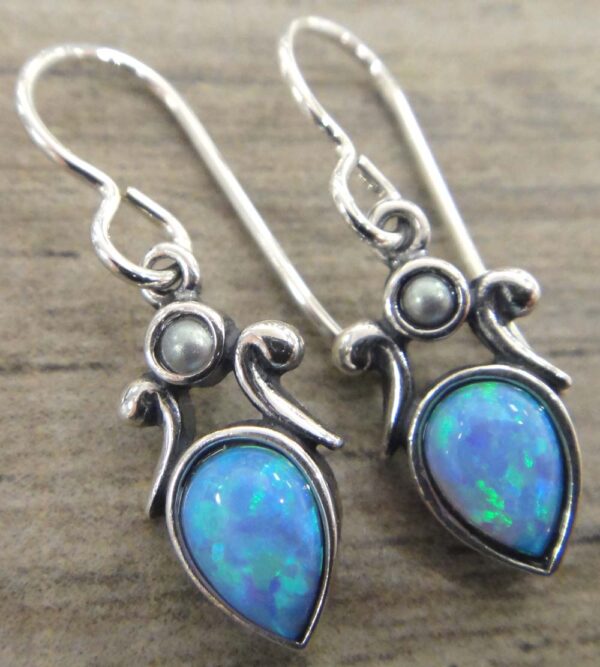 These created blue opal and freshwater pearl earrings are handmade by Sonoma Art Works.