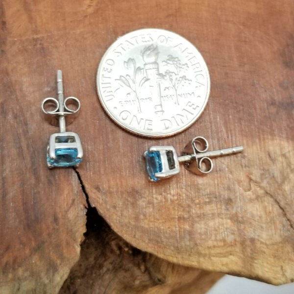 blue topaz and sterling silver earrings top view with dime for scale