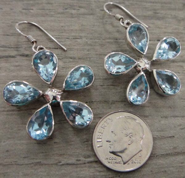 blue topaz flower earrings with dime for size