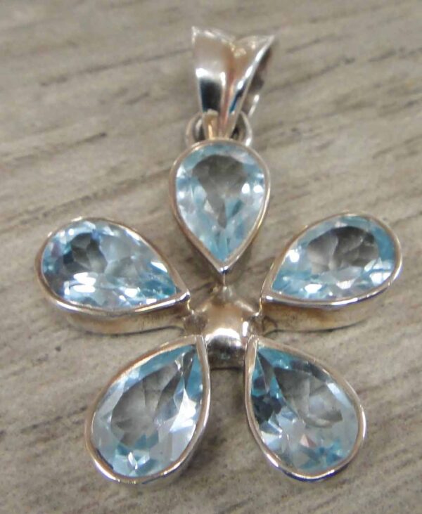 handmade blue topaz and sterling silver daisy flower pendant