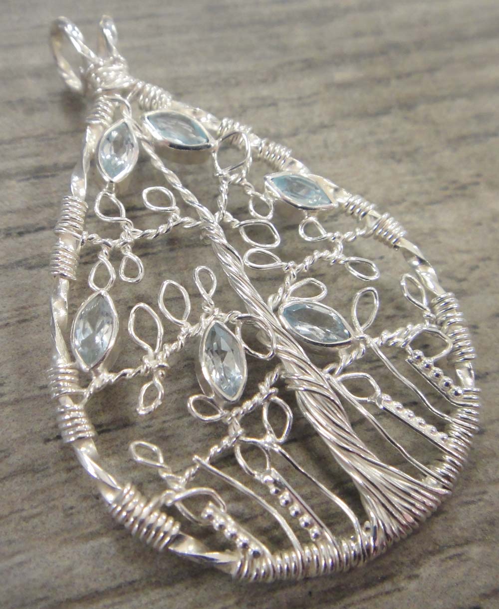 blue topaz and silver wire wrapped tree pendant