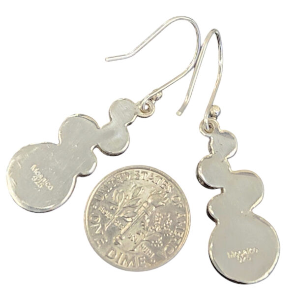 back of bold geometric earrings with dime for size comparison